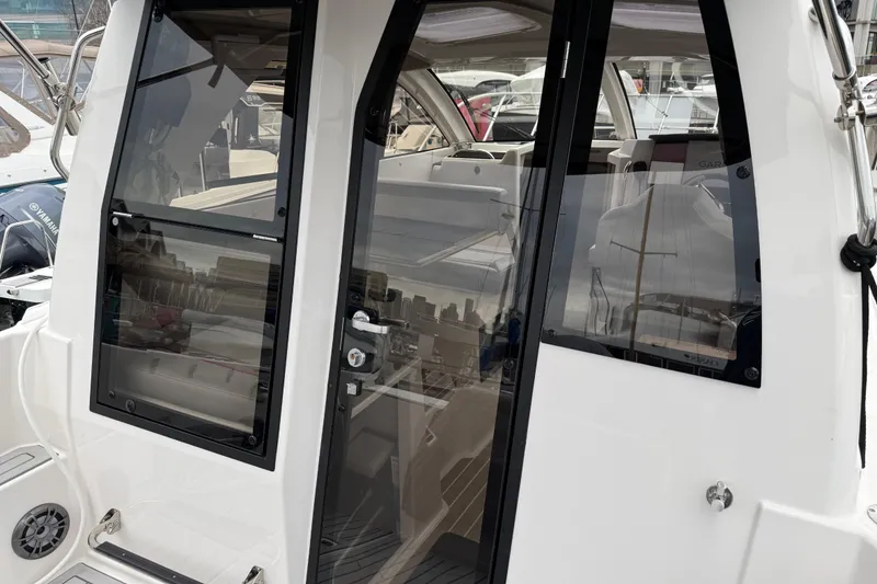 Slide: The Image of 2024 Solara S-250 Coupe boat interior with sleek glass doors and modern design. - 8
