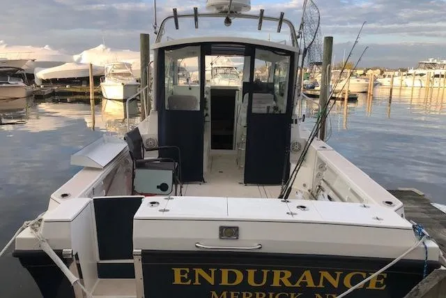 Slide: The Image of 2005 Albin 28 Tournament Express boat docked at marina, rear view. - 11