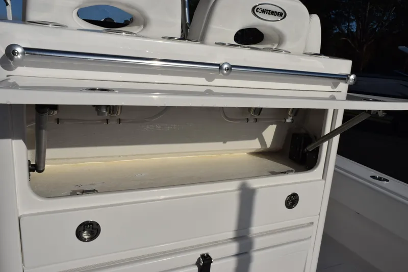 Slide: The Image of 2026 Contender 29 Bay boat storage compartment with open hatch and sleek design. - 10