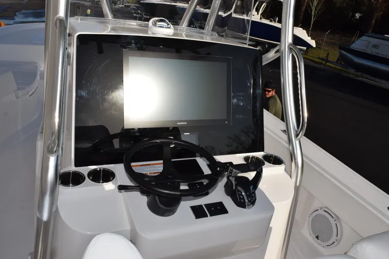 Slide: The Image of 2026 Contender 29 Bay boat console with Garmin display and steering wheel. - 12
