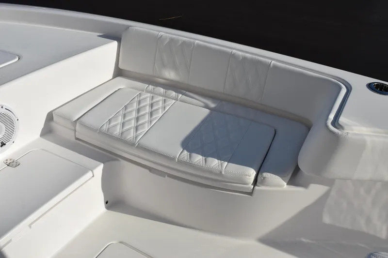 Slide: The Image of 2026 Contender 29 Bay boat with white cushioned seating and speaker detail. - 17