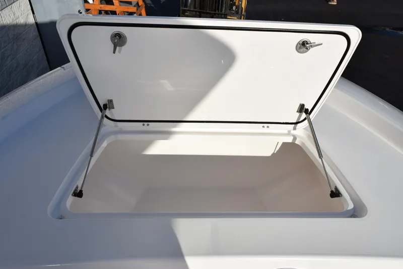 Slide: The Image of Open storage compartment on 2026 Contender 29 Bay boat, showcasing interior space. - 19