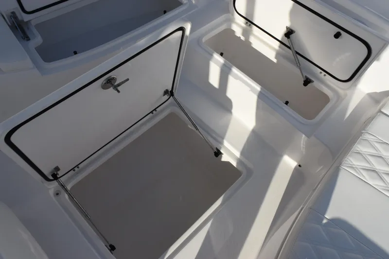 Slide: The Image of Open storage compartments on a 2026 Contender 29 Bay boat. - 21