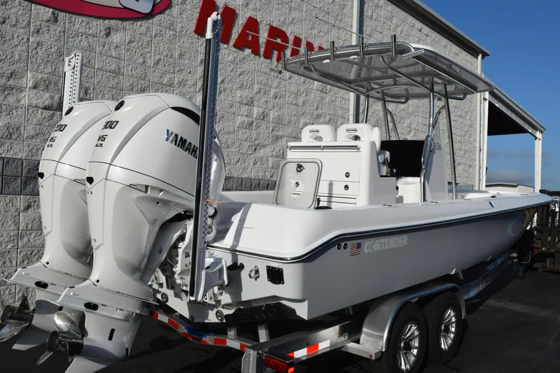 Slide: The Image of 2026 Contender 29 Bay boat with dual Yamaha engines on a trailer. - 4