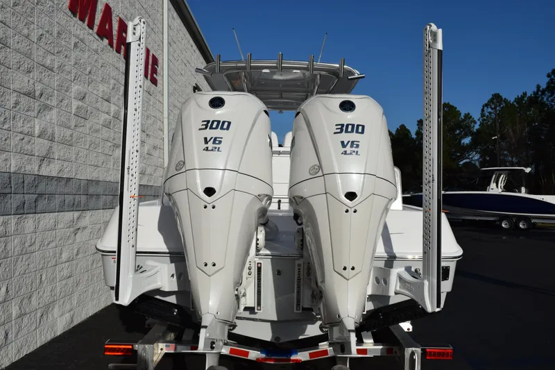 Slide: The Image of 2026 Contender 29 Bay boat with dual 300 V6 4.2L engines, rear view. - 5