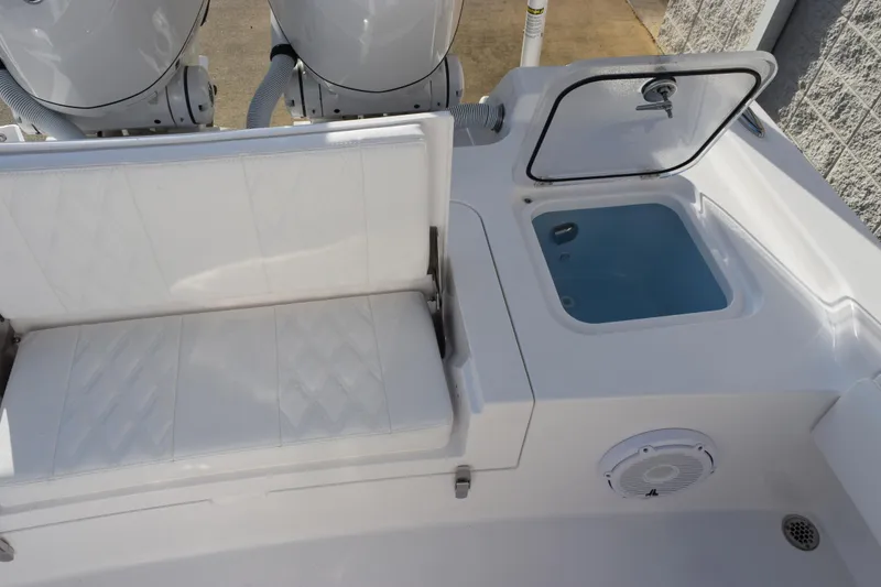 Slide: The Image of 2026 Contender 29 Bay boat interior with seating and storage compartment. - 8