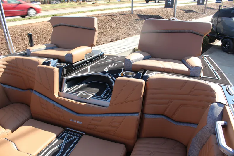 Slide: The Image of 2026 Tigé Ultré 25ZX boat interior with luxurious tan seating and modern design. - 13