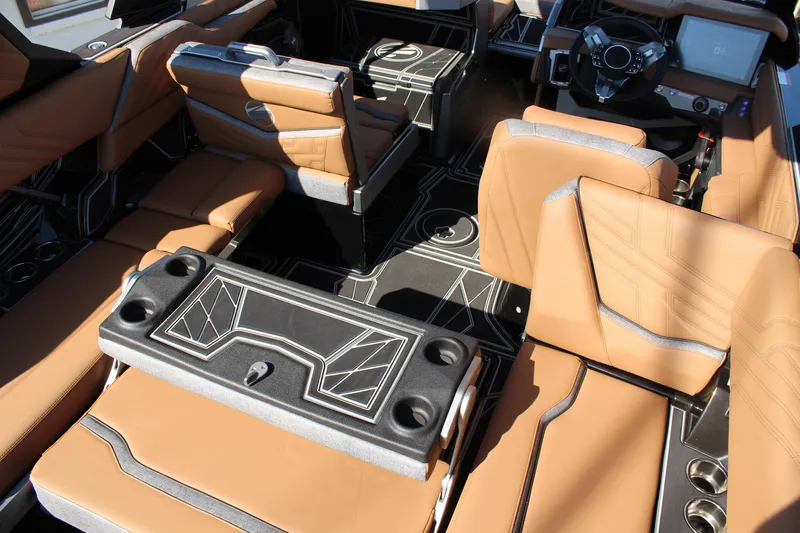 Slide: The Image of Luxurious interior of 2026 Tigé Ultré 25ZX boat with tan leather seating and modern design. - 15