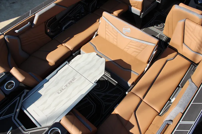 Slide: The Image of 2026 Tigé Ultré 25ZX boat interior with luxurious tan seating and modern design. - 16