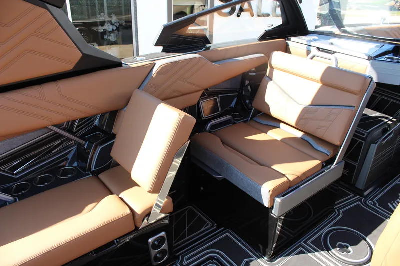 Slide: The Image of 2026 Tigé Ultré 25ZX interior with luxurious tan leather seating and modern design. - 18