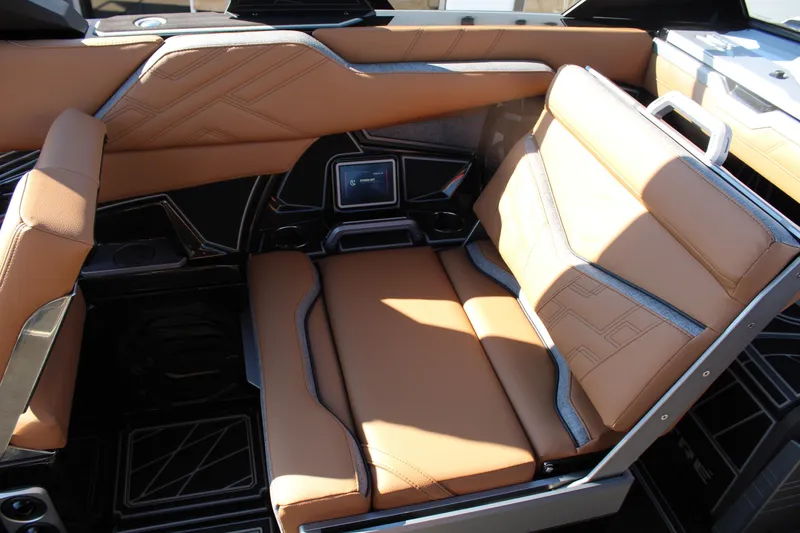 Slide: The Image of Luxurious interior of 2026 Tigé Ultré 25ZX boat with tan leather seating. - 19