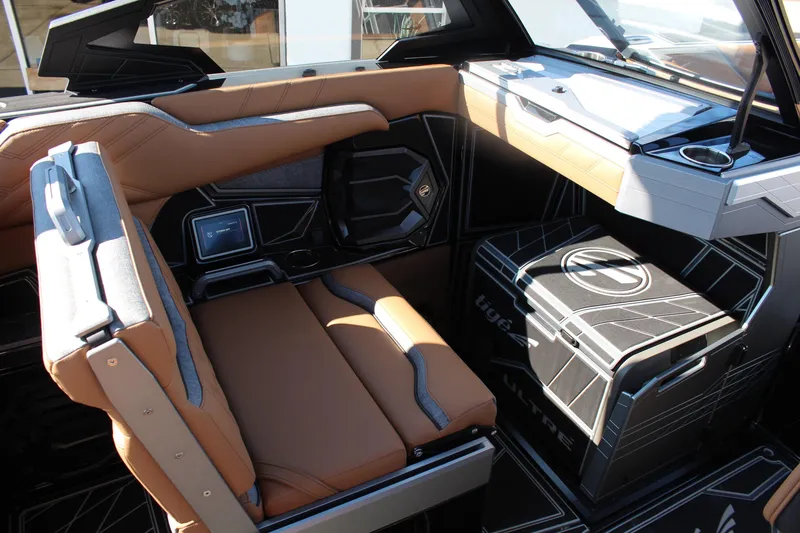 Slide: The Image of 2026 Tigé Ultré 25ZX interior with tan seating and modern dashboard design. - 20