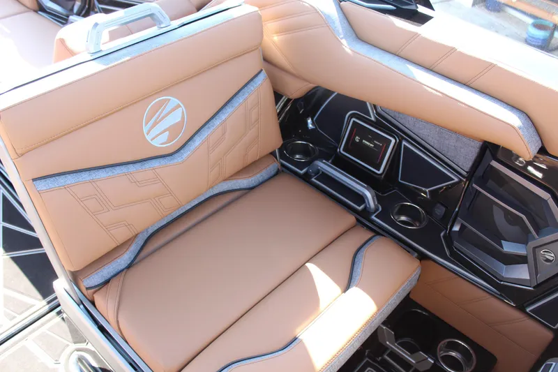 Slide: The Image of 2026 Tigé Ultré 25ZX boat interior with tan leather seats and modern dashboard. - 21