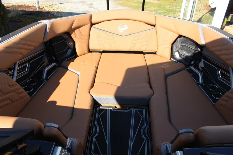 Slide: The Image of Luxurious interior of 2026 Tigé Ultré 25ZX boat with tan leather seating. - 24