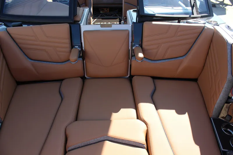 Slide: The Image of 2026 Tigé Ultré 25ZX boat interior with luxurious tan leather seating. - 25