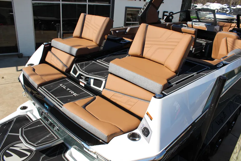 Slide: The Image of 2026 Tigé Ultré 25ZX boat with luxurious tan seating and sleek design. - 7