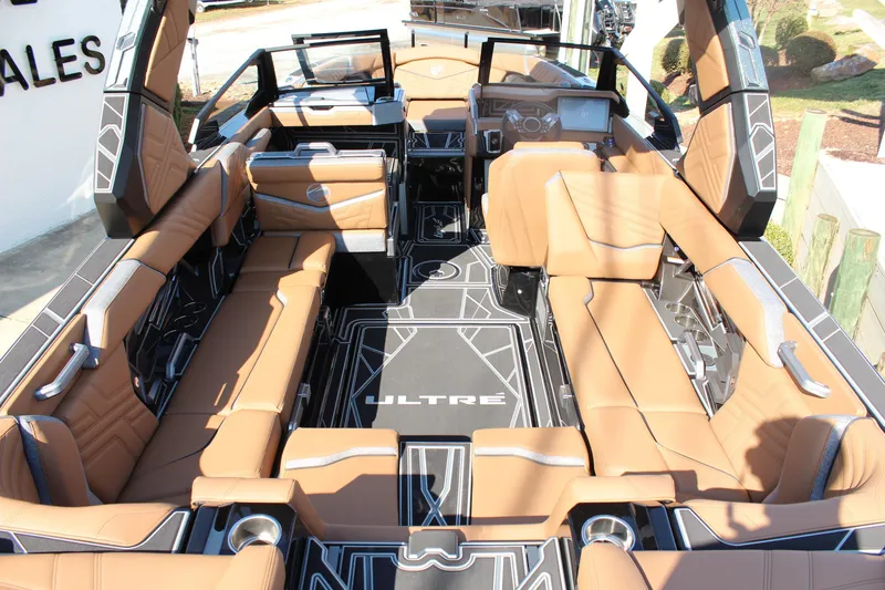 Slide: The Image of 2026 Tigé Ultré 25ZX boat interior with luxurious tan seating and modern design. - 9