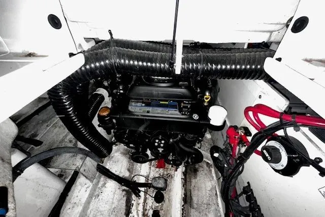 Slide: The Image of Engine compartment of a 2018 Sea Ray SDX 270 boat, showcasing mechanical components. - 18