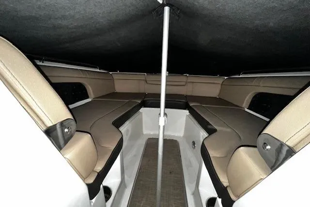 Slide: The Image of 2018 Sea Ray SDX 270 boat interior with beige seating and canopy. - 29