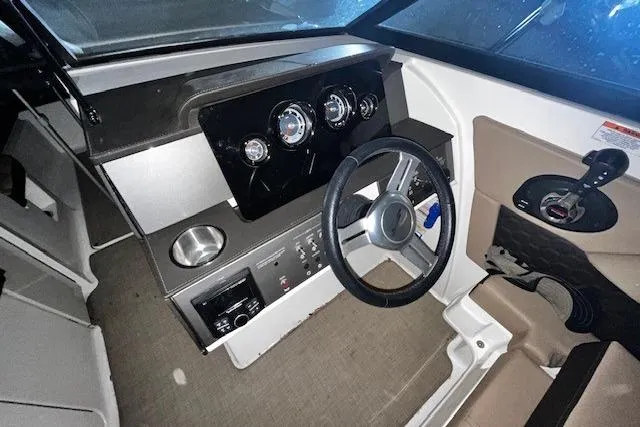 Slide: The Image of 2018 Sea Ray SDX 270 boat dashboard with steering wheel and control panel. - 30