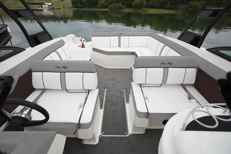 Slide: The Image of Manufacturer Provided Image: 2018 Sea Ray SDX 270 boat interior with white and gray seating. - 7