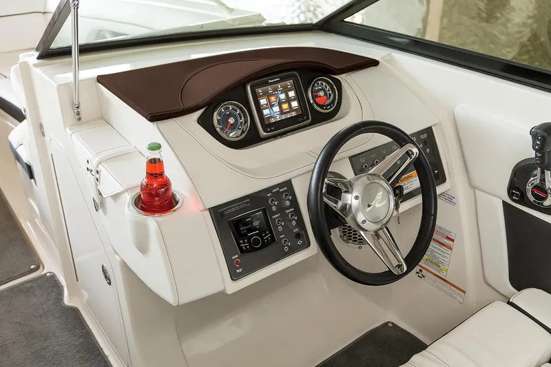 Slide: The Image of Manufacturer Provided Image: 2018 Sea Ray SDX 270 boat dashboard with steering wheel and control panel. - 8