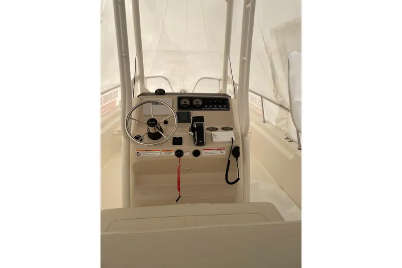 The Image of 2025 Boston Whaler 210 Montauk boat console with steering wheel and controls. - 0