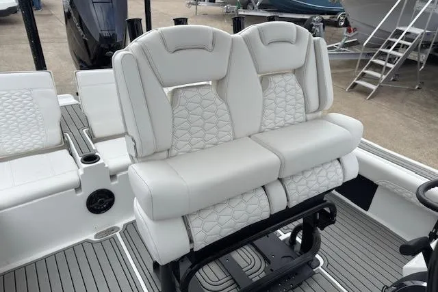 Slide: The Image of 2026 Tidewater 2500 Carolina Bay boat with luxurious white seating and modern design. - 10