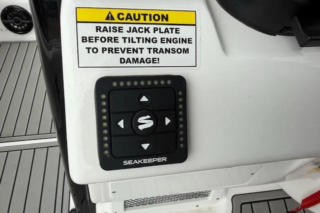 Slide: The Image of Control panel on 2026 Tidewater 2500 Carolina Bay boat with caution label. - 13