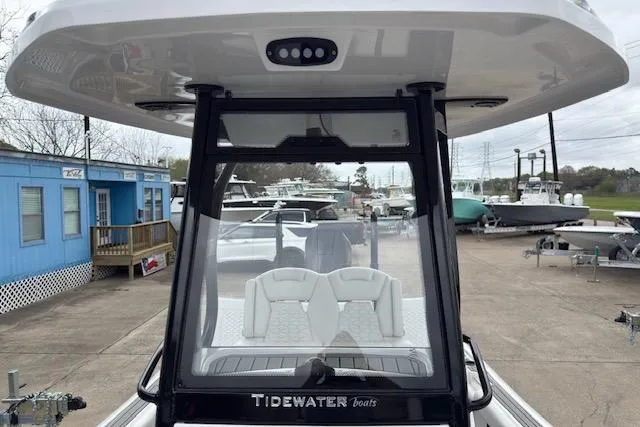 Slide: The Image of 2026 Tidewater 2500 Carolina Bay boat at a marina, showcasing sleek design and modern features. - 17