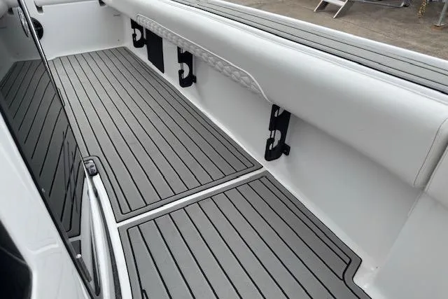 Slide: The Image of 2026 Tidewater 2500 Carolina Bay boat interior with sleek, modern deck design. - 19