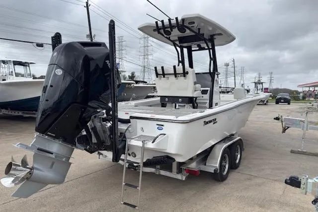Slide: The Image of 2026 Tidewater 2500 Carolina Bay boat on trailer, featuring powerful outboard motor. - 5