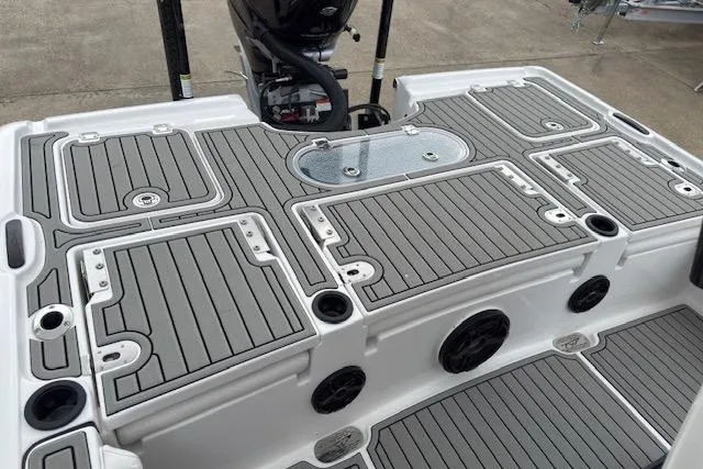 Slide: The Image of 2026 Tidewater 2500 Carolina Bay boat deck with sleek, modern design and storage compartments. - 8