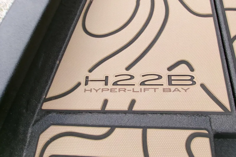Slide: The Image of 2026 Xpress H22B Hyper-Lift Bay boat floor detail with textured design. - 10