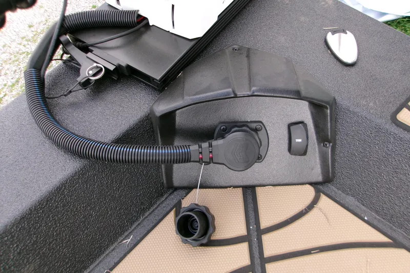 Slide: The Image of Control panel on 2026 Xpress H22B Bay boat deck with wiring and trim switch. - 11