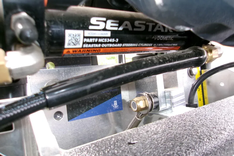 Slide: The Image of Close-up of SeaStar outboard steering cylinder on 2026 Xpress H22B Bay boat. - 14