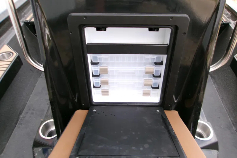 Slide: The Image of Storage compartment in 2026 Xpress H22B Bay boat, featuring organized tackle boxes. - 22