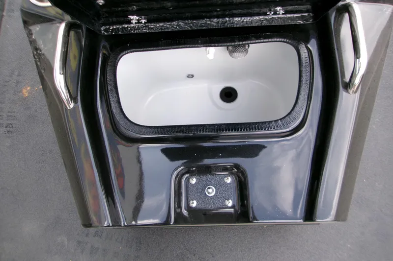 Slide: The Image of 2026 Xpress H22B Bay boat livewell, black exterior, open lid view. - 23