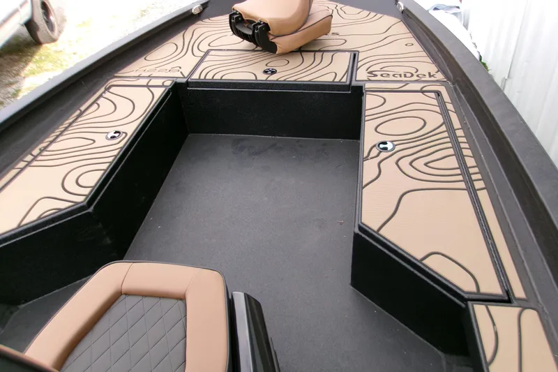 Slide: The Image of 2026 Xpress H22B Bay boat interior with SeaDek flooring and seating. - 9
