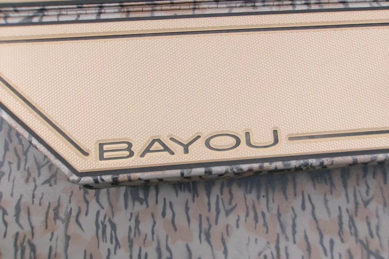 Slide: The Image of 2026 Xpress Bayou 180CC boat detail with textured surface and logo. - 15