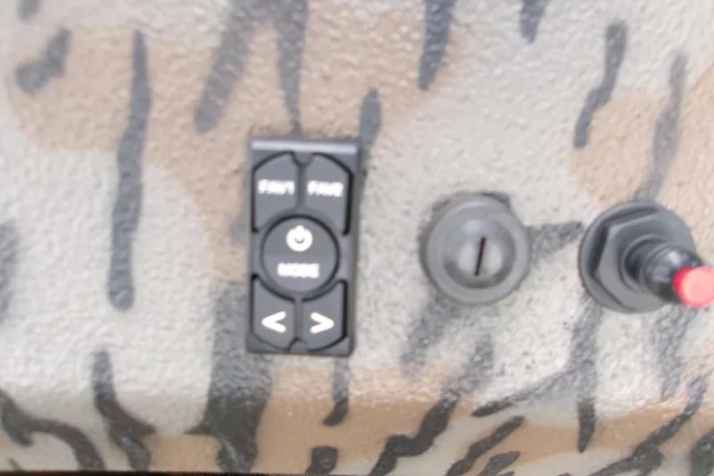 Slide: The Image of Control panel of 2026 Xpress Bayou 180CC boat with camouflage design. - 18