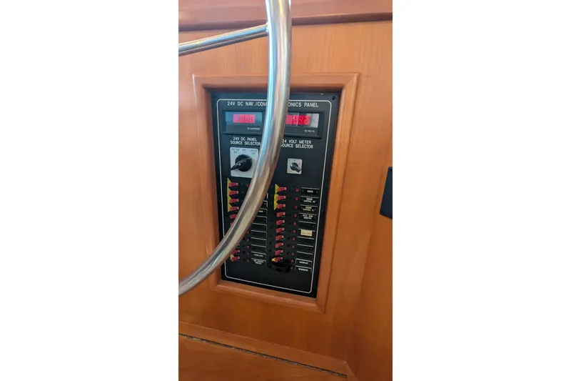 Slide: The Image of Control panel of a 2005 Kadey-Krogen Pilothouse boat, featuring navigation and electronics settings. - 110