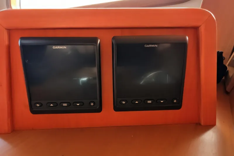 Slide: The Image of Dual Garmin displays on 2005 Kadey-Krogen Pilothouse dashboard. - 114