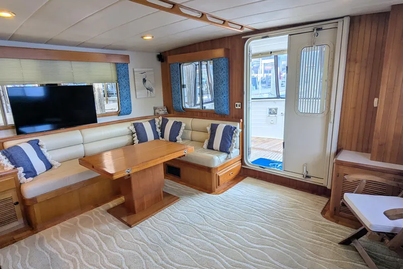 Slide: The Image of Luxurious 2005 Kadey-Krogen Pilothouse interior with cozy seating and elegant wood finishes. - 133