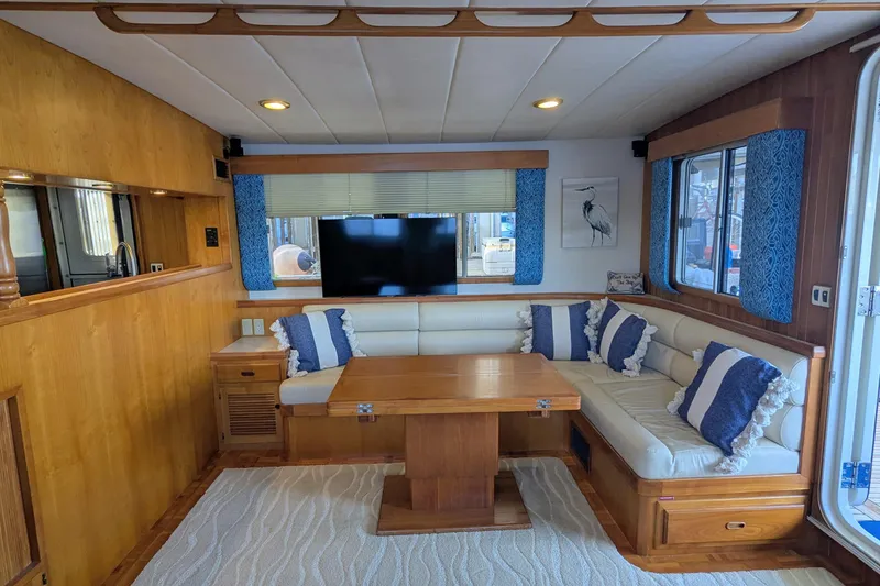 Slide: The Image of Luxurious 2005 Kadey-Krogen Pilothouse interior with cozy seating and elegant wood finish. - 134