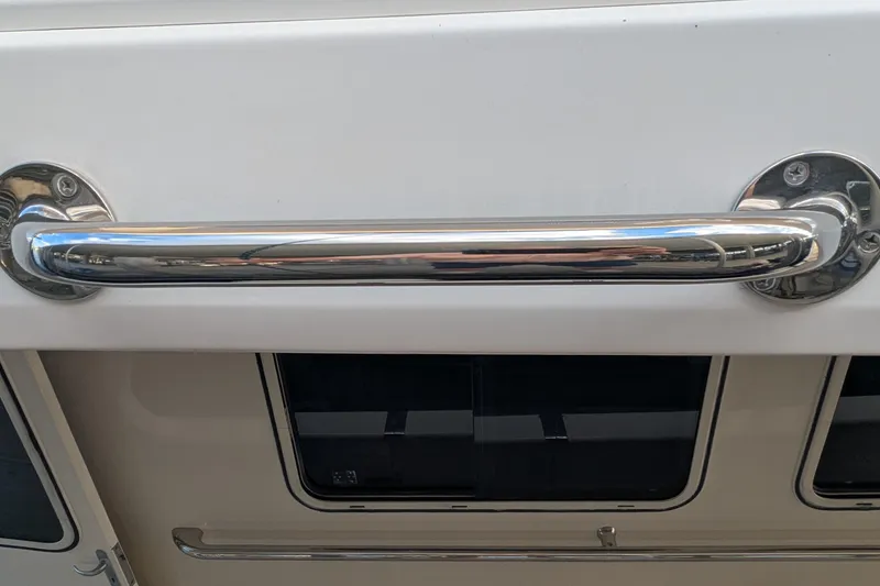 Slide: The Image of Chrome handrail on 2005 Kadey-Krogen Pilothouse boat exterior. - 14