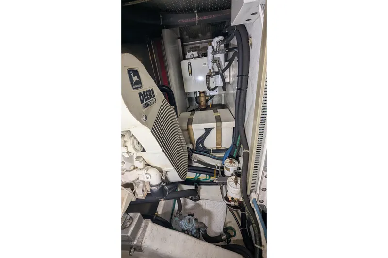 Slide: The Image of Engine room of 2005 Kadey-Krogen Pilothouse with John Deere power system. - 147