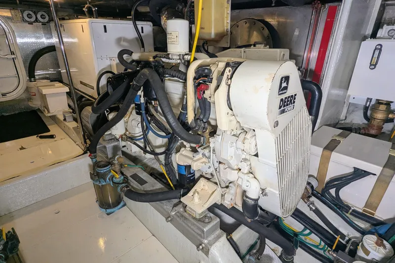 Slide: The Image of Engine room of a 2005 Kadey-Krogen Pilothouse with Deere Power engine. - 148