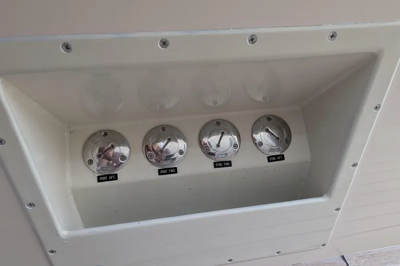 Slide: The Image of Fuel intake panel on a 2005 Kadey-Krogen Pilothouse boat, featuring labeled ports. - 15