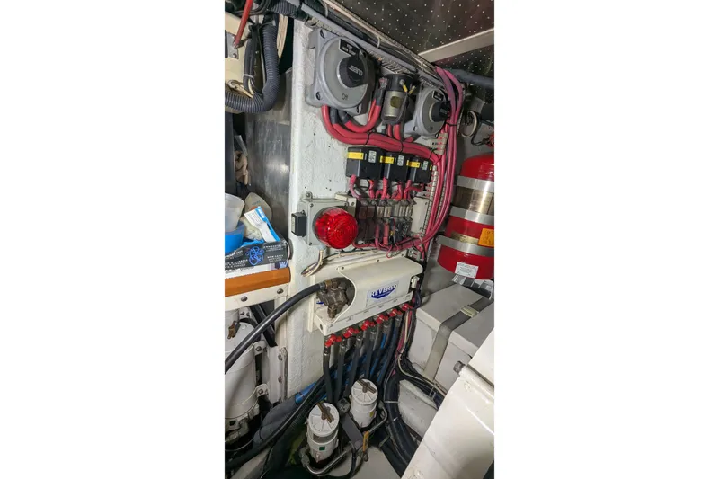 Slide: The Image of Engine room of 2005 Kadey-Krogen Pilothouse with wiring and fire extinguisher. - 151